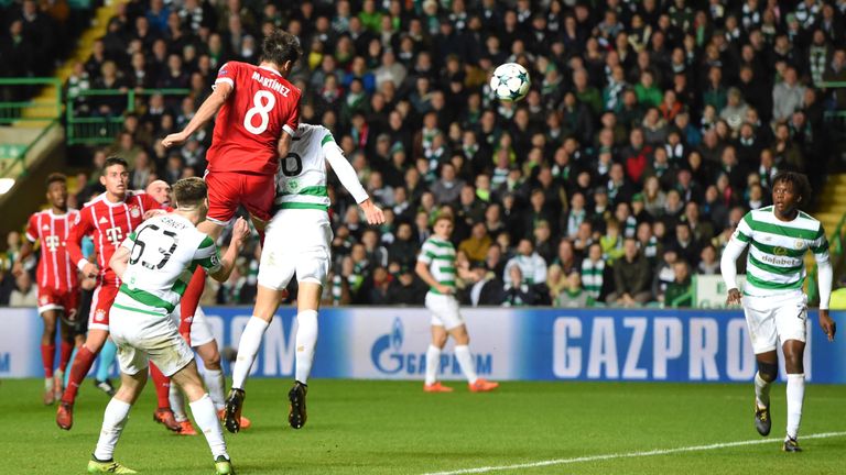 Javi Martinez rises above Nir Bitton to head in Bayern Munich's winner and secure their place in the last 16 of the Champions League