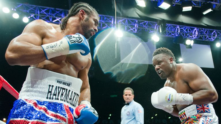 David Haye (L) throws a punch at Dereck Chisora during the WBO International and WBA Intercontinental Heavyweight Championship fight at the West Ham footba