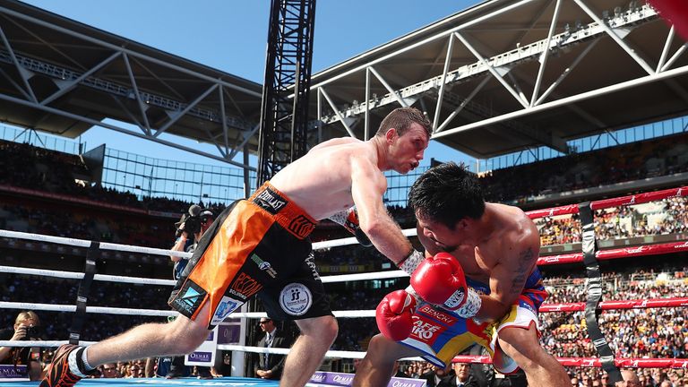 BRISBANE, AUSTRALIA - JULY 02:  Manny Pacquiao of the Philippines and  Jeff Horn of Australia exchange punches during the WBO World Welterweight Title Figh