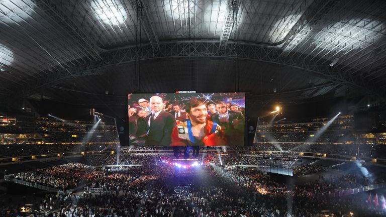 Manny Pacquiao of the Philippines is projected onto a large TV screen at the start of his World Boxing Organization (WBO) welterweight title fight against 