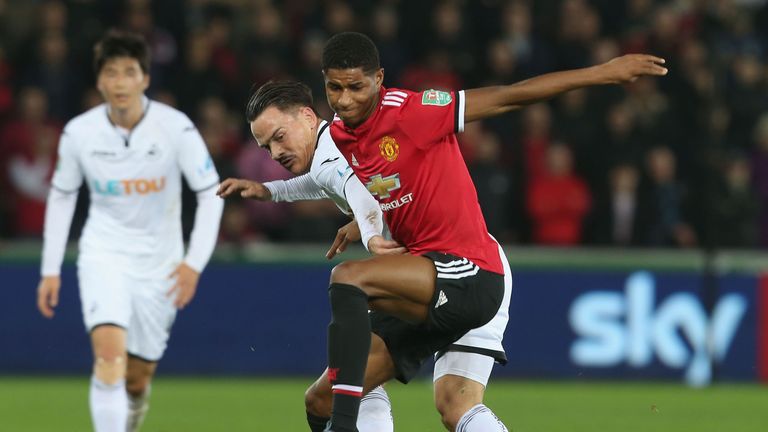 Manchester United's Marcus Rashford holds of a challenge by a Swansea player in the Carabao Cup tie at Liberty Stadium on October 24, 2017.