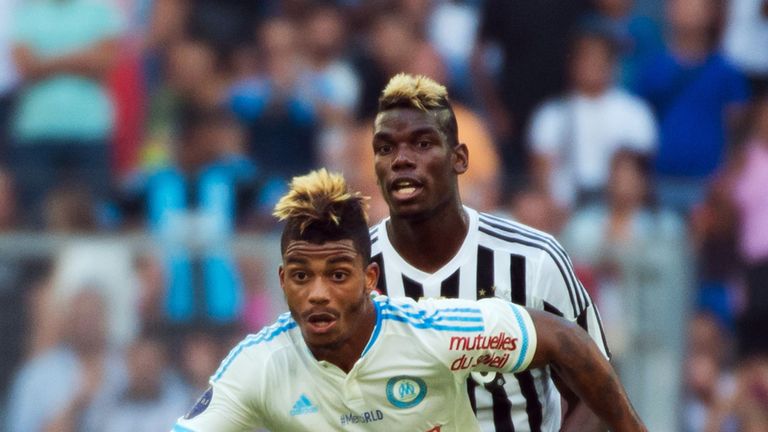 Juventus midfielder Paul Pogba vies with Marseille's Mario Lemina during a friendly match in 2015