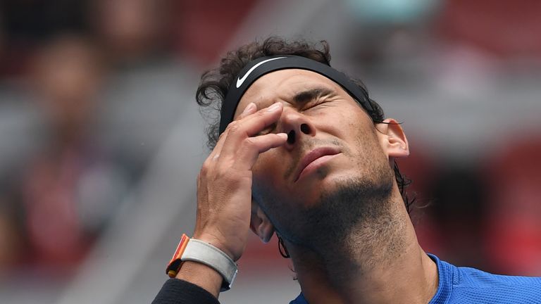 Rafael Nadal of Spain reacts during his men's singles quarter-final against John Isner of the US at the China Open tennis tournament in Beijing on October 