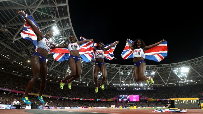  Asha Philip, Deriree Henry, Dina Asher-Smith and Daryll Neita of Great Britain celebrate winning silver in the Women's 4x100 relay