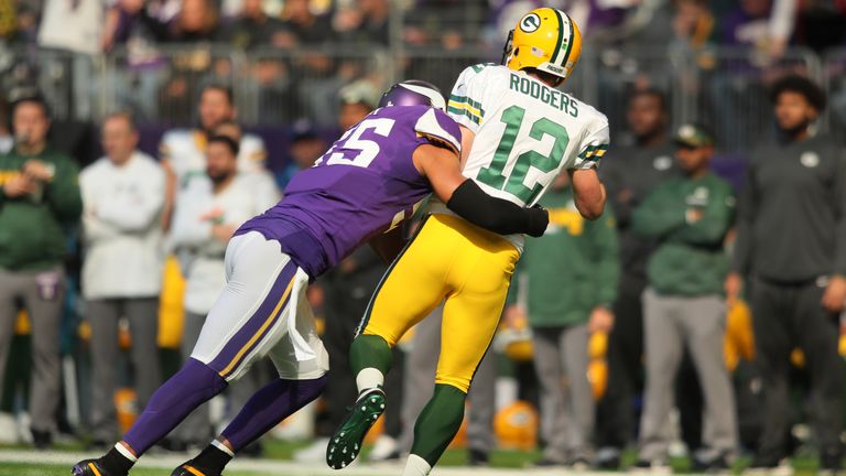 MINNEAPOLIS, MN - OCTOBER 15: Anthony Barr #55 of the Minnesota Vikings hits quarterback Aaron Rodgers #12 of the Green Bay Packers during the first quarte
