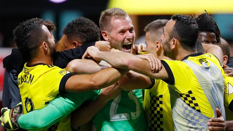Adam Jahn #12 of Columbus Crew reacts after converting a penalty kick to give the Crew a win over Atlanta United 3-1 on penalties in MLS