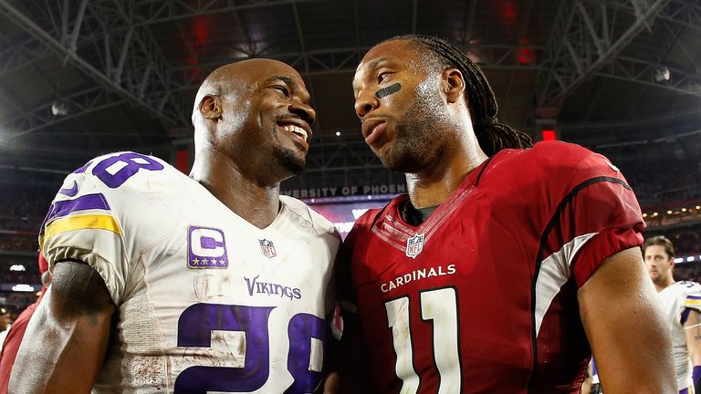 GLENDALE, AZ - DECEMBER 10:  Running back Adrian Peterson #28 of the Minnesota Vikings and wide receiver Larry Fitzgerald #11 of the Arizona Cardinals talk