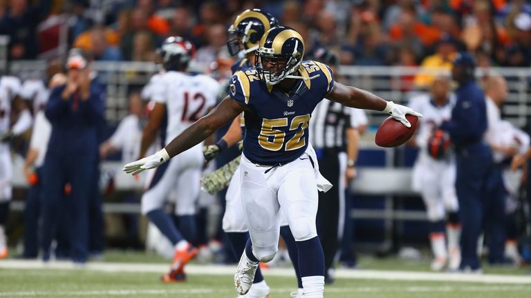 Alec Ogletree #52 of the St. Louis Rams celebrates after making an interception