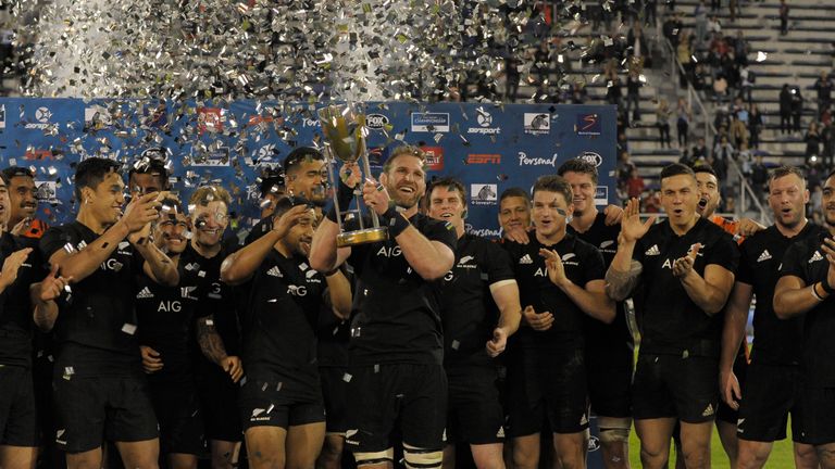 Kieran Read lifts the trophy for New Zealand after their win against Argentina