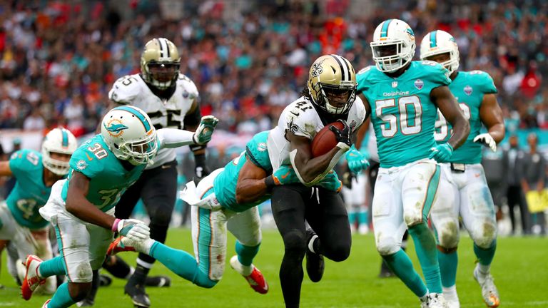 LONDON, ENGLAND - OCTOBER 01:  Alvin Kamara of the New Orleans Saints scores a touchdown during the NFL match between New Orleans Saints and Miami Dolphin