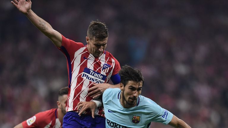 Barcelona's Portuguese midfielder Andre Gomes (R) vies with Atletico Madrid's Spanish midfielder Gabi during the Spanish league football match Club Atletic