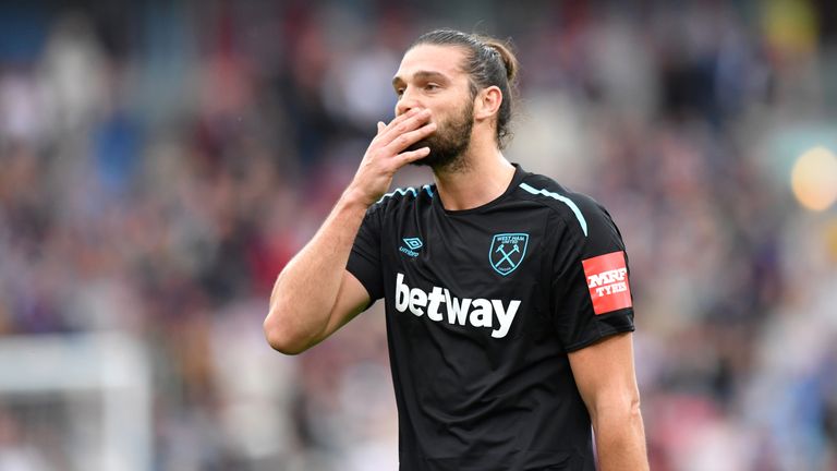 West Ham United's Andy Carroll leaves the field after being sent off for a second bookable offence during the Premier League match at Turf Moor, Burnley.