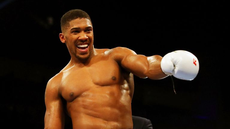 Anthony Joshua of Great Britain celebrates after defeating Dominic Breazeal