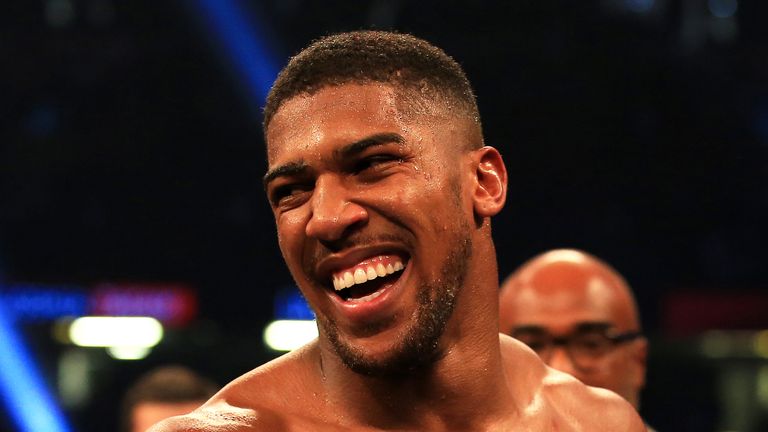Anthony Joshua celebrates victory over Carlos Takam during their World Heavyweight Title bout in Cardiff