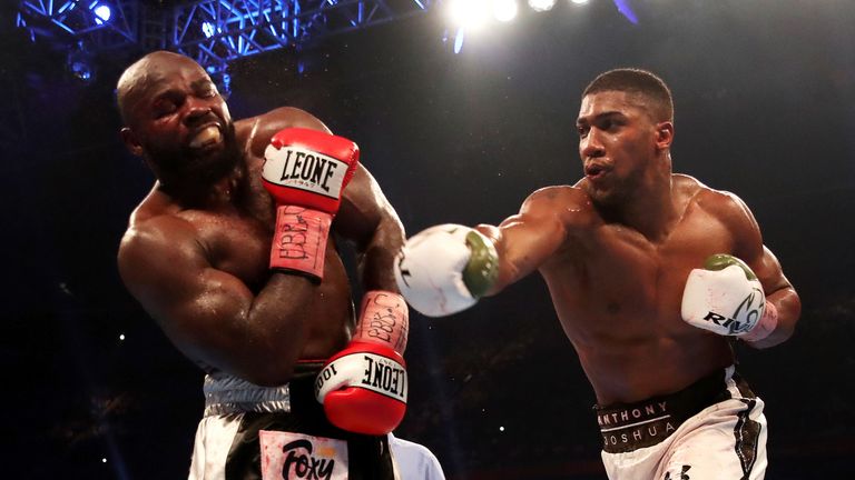 Anthony Joshua and Carlos Takam during their Heavyweight Title bout at the Principality Stadium