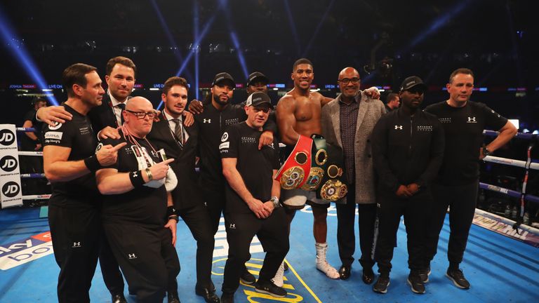 CARDIFF, WALES - OCTOBER 28:  Anthony Joshua celebrates victory with his team after the IBF, WBA & IBO Heavyweight Championship contest against Carlos Taka
