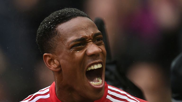 Manchester United's French striker Anthony Martial celebrates after scoring the opening goal of the English Premier League football match between Mancheste