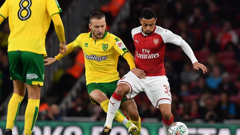 Norwich City's German midfielder Tom Trybull (L) vies with Arsenal's French midfielder Francis Coquelin during the English League Cup fourth round football