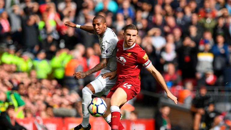 Manchester United's English midfielder Ashley Young (L) vies with Liverpool's English midfielder Jordan Henderson during the English Premier League footbal