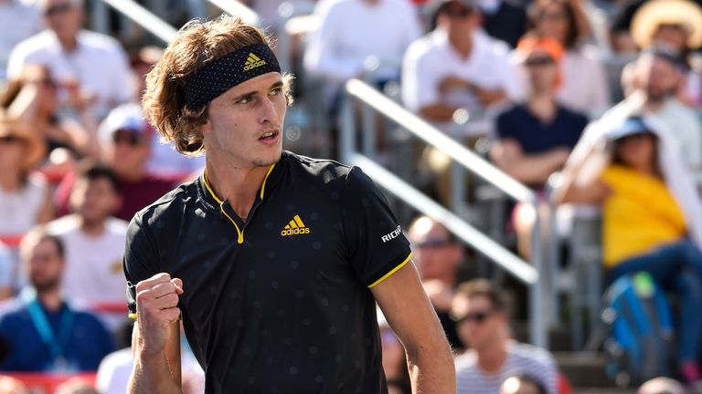Alexander Zverev of Germany reacts after scoring a point against Roger Federer of Switzerland during day ten of the Rogers Cup