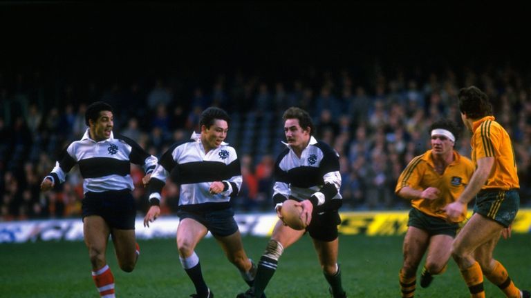 15 Dec 1984:  Serge Blanco (left) of France, Rory Underwood (centre left) and Gary Rees (centre) both of England power forward during the  match between th