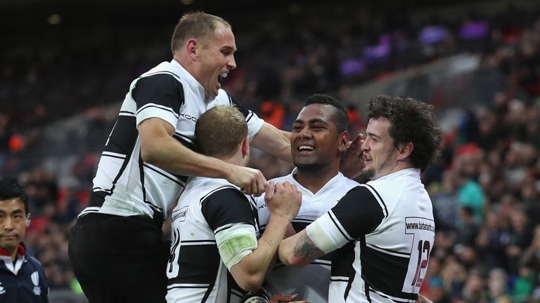 LONDON, ENGLAND - NOVEMBER 05:  Taqele Naiyaravoro of Barbarians celebrates his try with Andy Ellis, Matt Faddes and Richard Buckman during the Killik Cup 