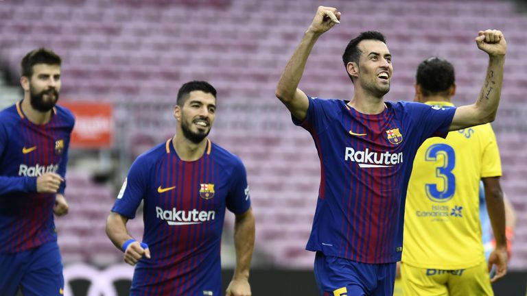 Barcelona's Spanish midfielder Sergio Busquets (R) celebrates after scoring a goal during the Spanish league football match FC Barcelona vs UD Las Palmas p