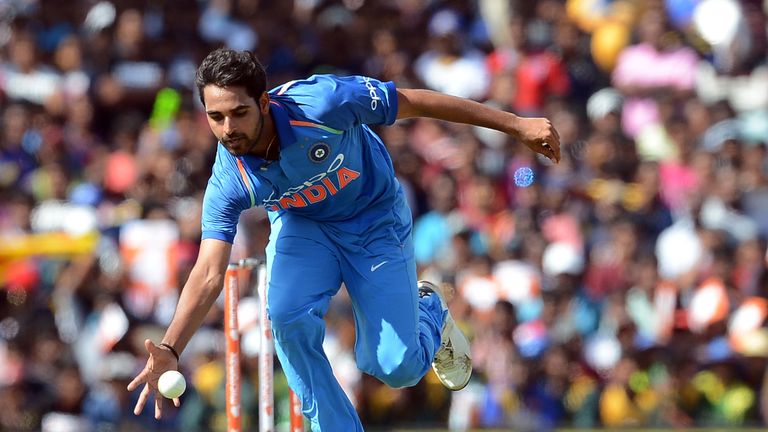 TOPSHOT - Indian cricketer Bhuvneshwar Kumar dives as he attempts to field a ball hit by Sri Lankan cricketer Dhanushka Gunathilaka during the first One Da