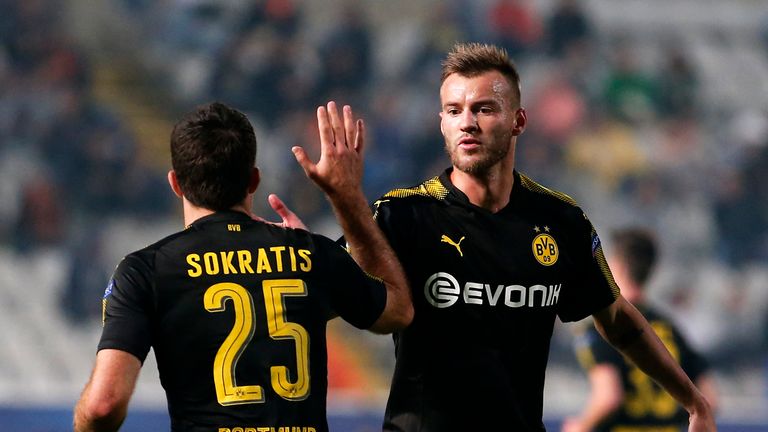 Dortmund's Ukrainian forward Andrei Yarmolenko (R) congratulates Dortmund's Greek defender Sokratis Papastathopoulos after scoring his team's equaliser dur