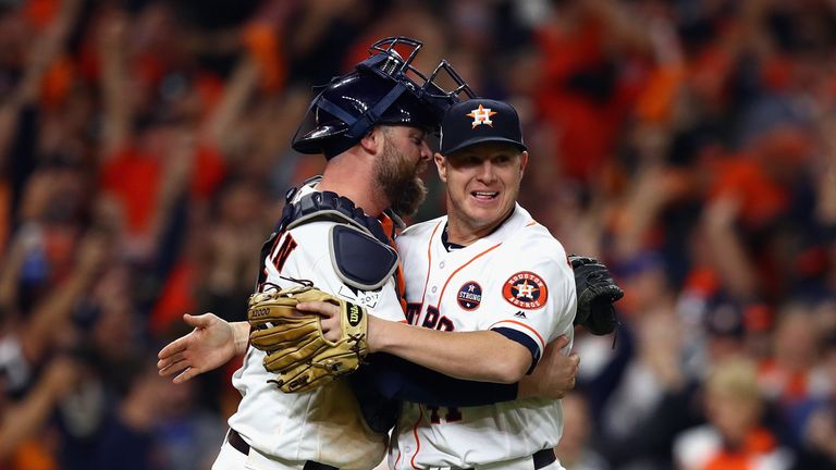 HOUSTON, TX - OCTOBER 27:  Brad Peacock #41 and Brian McCann #16 of the Houston Astros celebrate after defeating the Los Angeles Dodgers in game three of t