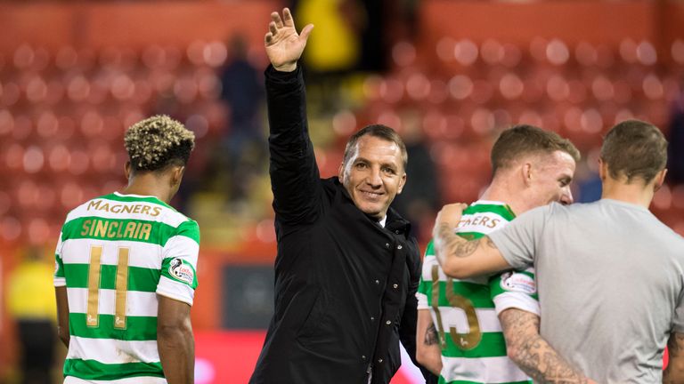 Brendan Rodgers acknowledges the travelling support at full-time at Pittodrie