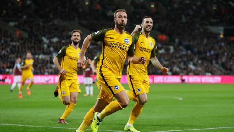 LONDON, ENGLAND - OCTOBER 20:  Glenn Murray of Brighton and Hove Albion (front) celebrates as he scores their first goal during the Premier League match be