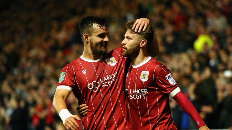 BRISTOL, ENGLAND - OCTOBER 24:  Matty Taylor of Bristol City celebrates with teammate Bailey Wright after scores his sides first goal during the Caraboa Cu