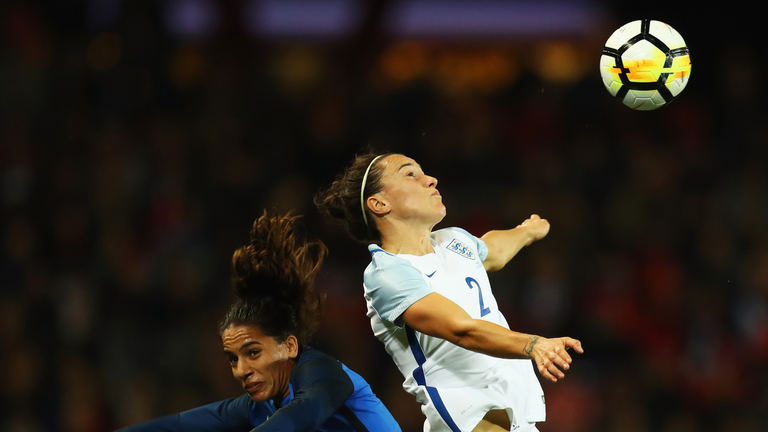 Lucy Bronze challenges for the ball