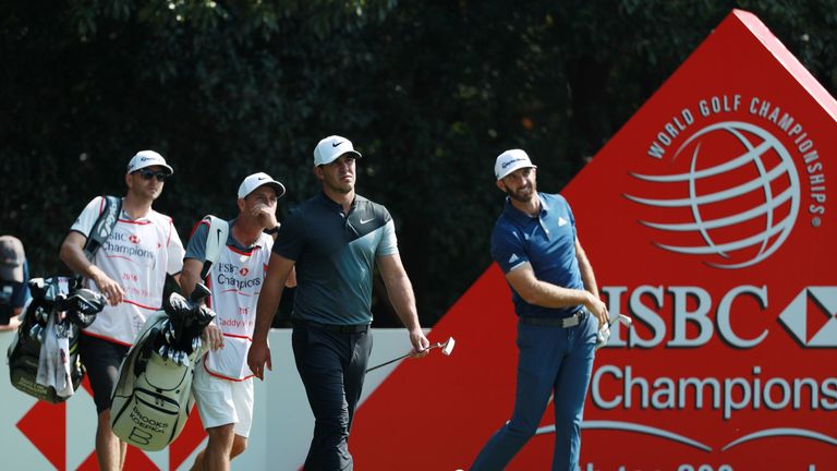 SHANGHAI, CHINA - OCTOBER 28:  Brooks Koepka of the United States walks from the fourth tee as Dustin Johnson of the United States watches his shot during 