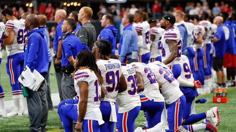 ATLANTA, GA - OCTOBER 01: Buffalo Bills players kneel during the national anthem prior to the first half against the Atlanta Falcons at Mercedes-Benz Stadi