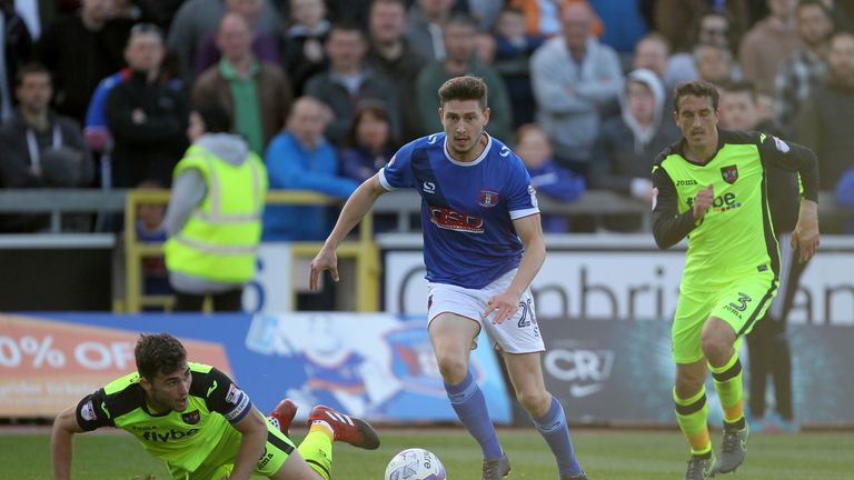 Carlisle's Shaun Miller sprints at the Exeter defence during the Sky Bet League Two Play Off, First Leg match at Brunton Park, Carlisle.