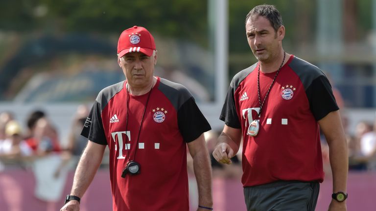 Bayern Munich's Italian head coach Carlo Ancelotti (L) and Bayern Munich's assistent coach Paul Clement talk during the first training session with new Bay