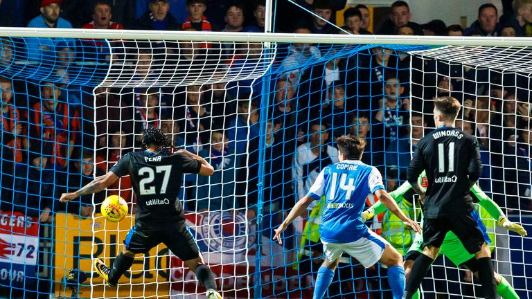 Carlos Pena (left) stretches to open the scoring at McDiarmid Park