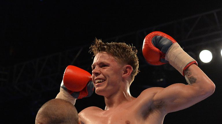 GLASGOW, SCOTLAND - APRIL 15: Charlie Edwards (grey and red shorts), celebrates after beating Iain Butcher (white and black shorts) during vacant British S