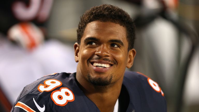 CHICAGO, IL - AUGUST 29: Corey Wootton #98 of the Chicago Bears talks with a teammate on the bench during a game against the Cleveland Browns at Soldier Fi