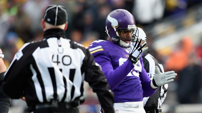 MINNEAPOLIS, MN - DECEMBER 28: Corey Wootton #99 of the Minnesota Vikings celebrates a sack of Jay Cutler #6 of the Chicago Bears by doing the robot during