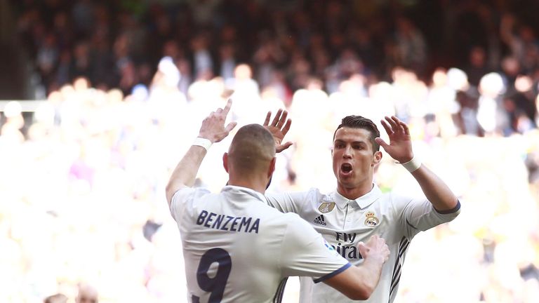 MADRID, SPAIN - APRIL 02:  Karim Benzema (L) of Real Madrid CF celebrates scoring their opening goal with teammate Cristiano Ronaldo (R) during the La Liga