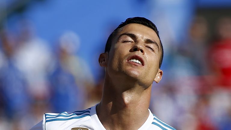 Real Madrid's Portuguese forward Cristiano Ronaldo reacts after missing a goal opportunity during the Spanish league football match Getafe CF vs Real Madri