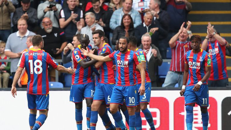 LONDON, ENGLAND - OCTOBER 14: Yohan Cabaye of Crystal Palace (obscure) celebrates scoring his sides first goal with his Crystal Palace team mates during th