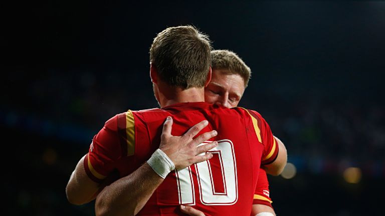 Dan Biggar hugs Rhys Priestland of Wales during the 2015 Rugby World Cup Pool A match between England and Wales at Twickenham