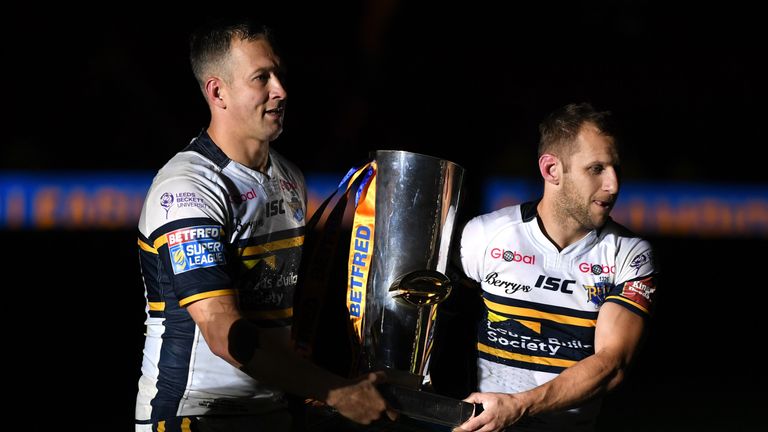  Danny McGuire and Rob Burrow (R) of Leeds Rhinos hold the trophy