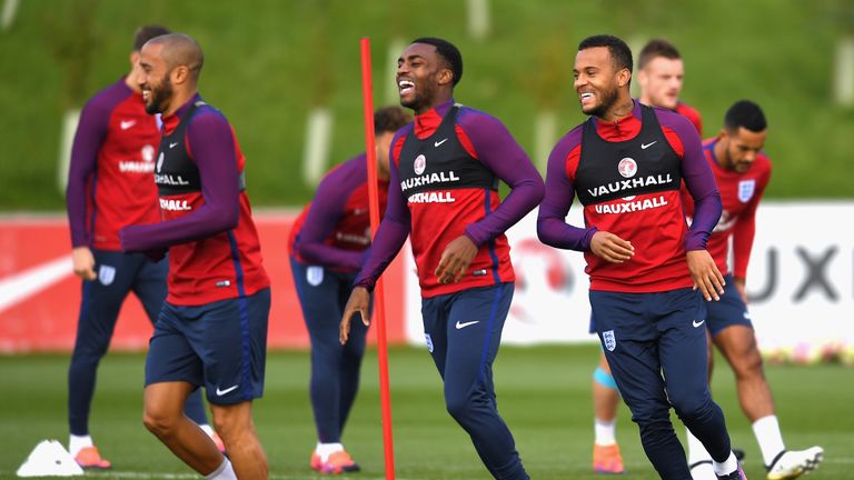 BURTON-UPON-TRENT, ENGLAND - OCTOBER 07: (L-R) Andros Townsend, Danny Rose and Ryan Bertrand of England in conversation during an England training session 