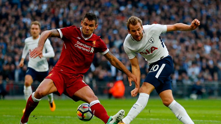 Liverpool's Croatian defender Dejan Lovren (L) vies with Tottenham Hotspur's English striker Harry Kane during the English Premier League football match be