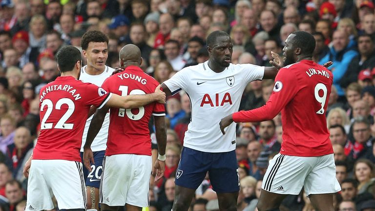 Dele Alli and Ashley Young confront each other during the Premier League match at Old Trafford